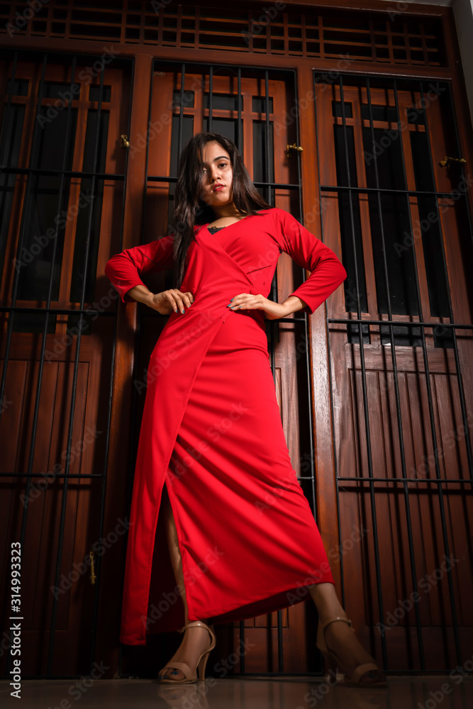 Beautiful young woman in a red dress