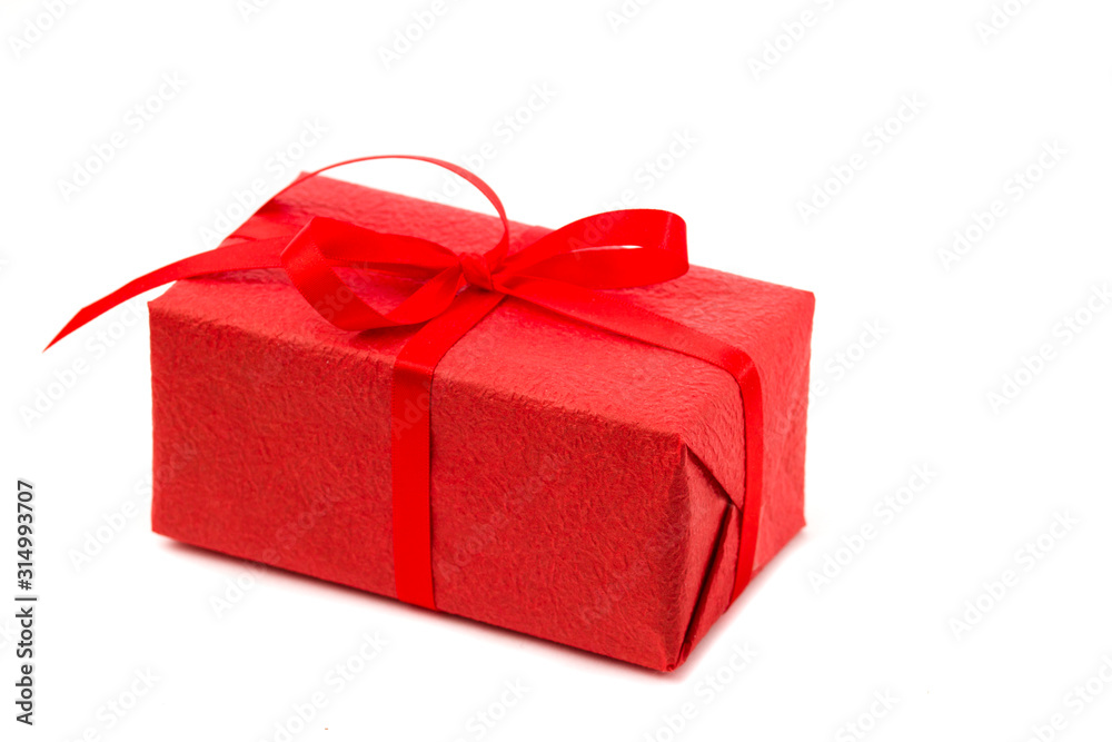 Red gift box with red ribbon isolated on white background. Red gift box with red ribbon isolated on white background.