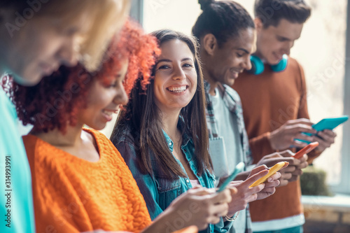 Students using phones and playing games while having break from study