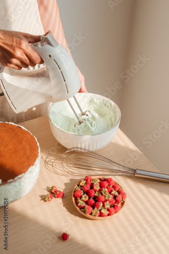 Fototapeta Whip cream preparing to make sponge cake or red velvet