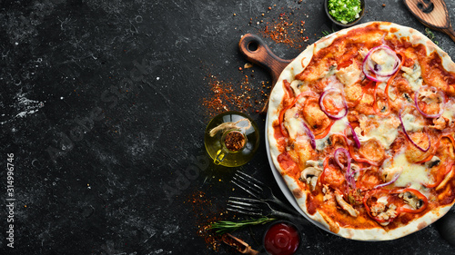 Fotografie, Obraz Homemade pizza on a black stone background