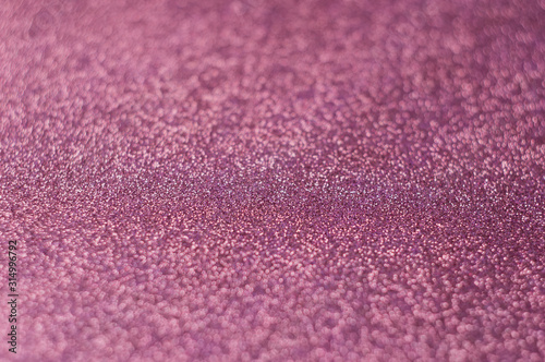 Luxurious pink glitter with bokeh, defocused background. Concept for St. Valentine's Day, holiday and decoration.
