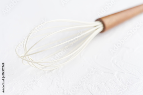 Kitchen tools background. Kitchen utensil, whisk, spatula. Blank space for a text. Copy spaces