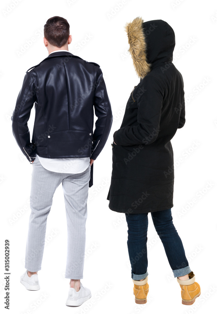 Back view of couple in winter jacket. Back view of couple in winter jacket.