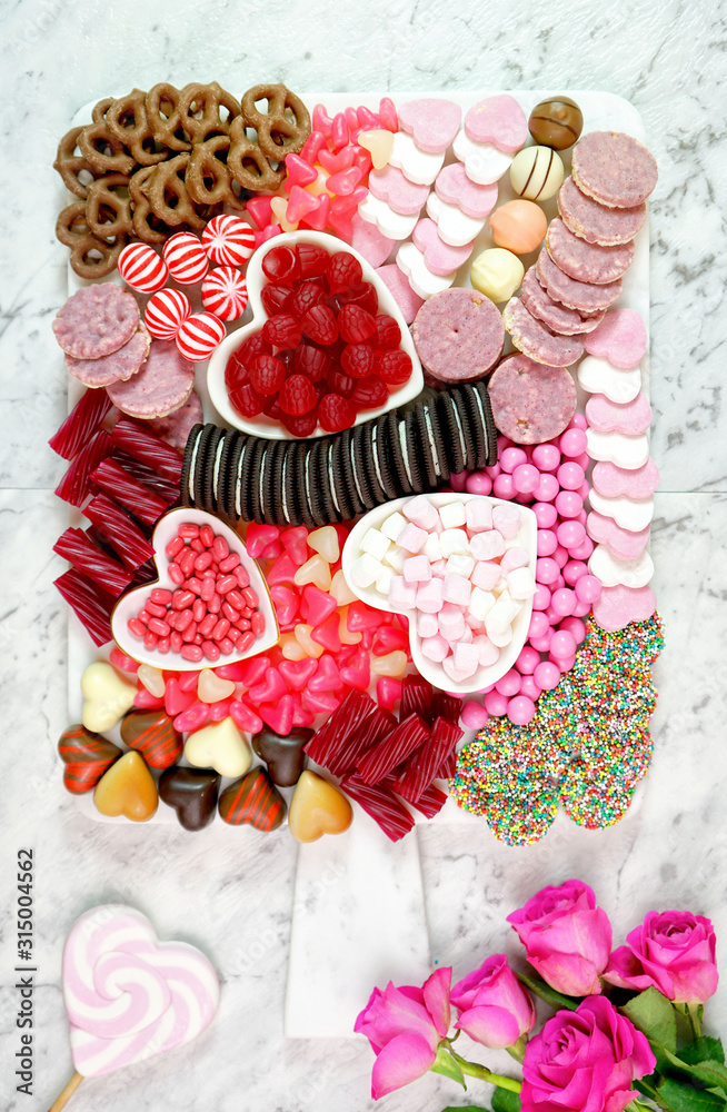 Happy Valentine's Day flat lay overhead candy and cookies dessert charcuterie grazing platter. Happy Valentine's Day flat lay overhead candy and cookies dessert charcuterie grazing platter.