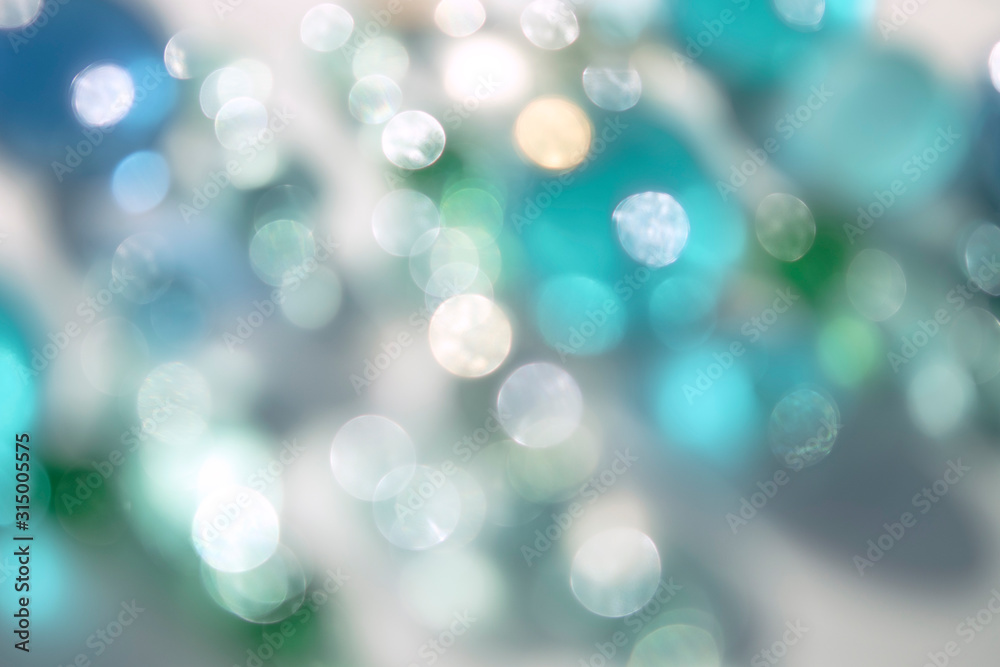 Obraz premium Bright delicate natural bokeh background. Circles of defocused light. Abstract bright shiny background.