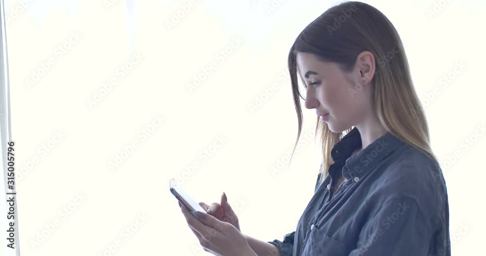 Attractive Young Adult Influencer Woman Typing on Smartphone