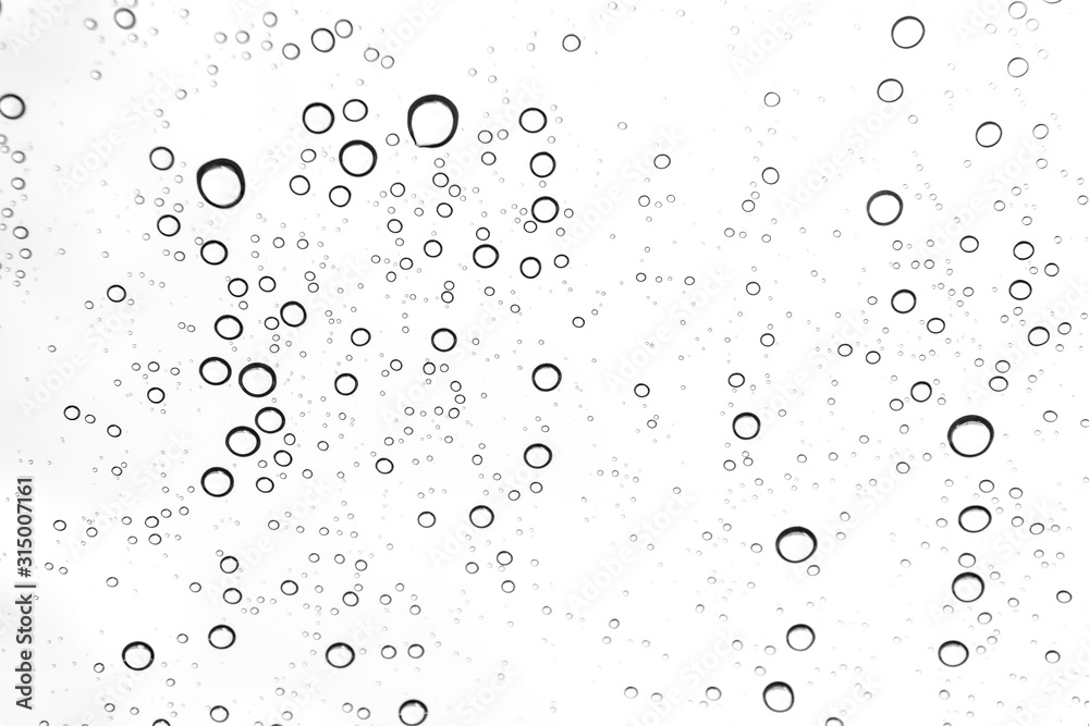 Rain drops on window glasses surface Natural Pattern of raindrops. Natural pattern of raindrops on white background for your design.