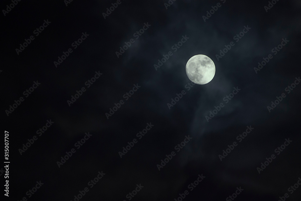Night moon in a cloudy sky Night moon in a cloudy sky