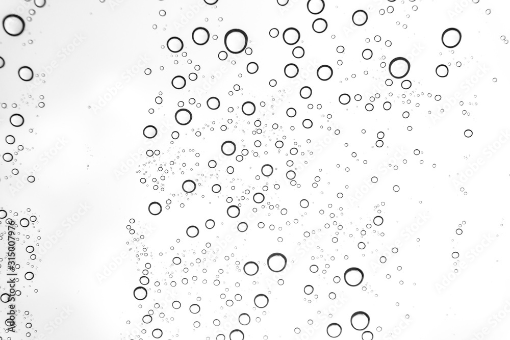 Rain drops on window glasses surface Natural Pattern of raindrops. Natural pattern of raindrops on white background for your design. Rain drops on window glasses surface Natural Pattern of raindrops. Natural pattern of raindrops on white background for your design.