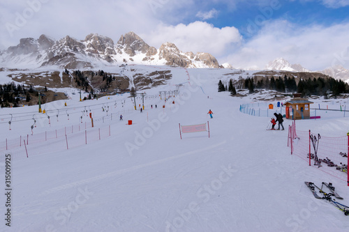 Ski slope at San Pellegrino ski resort in Dolomites, Italy