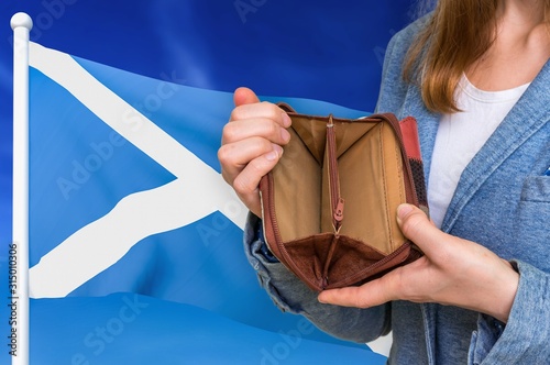 Poor person with empty wallet in Scotland