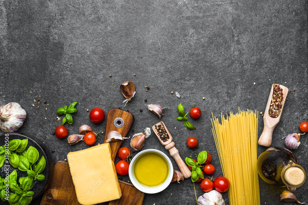 Italian food ingredients of spaghetti bolognese pasta, tomatoes, basil