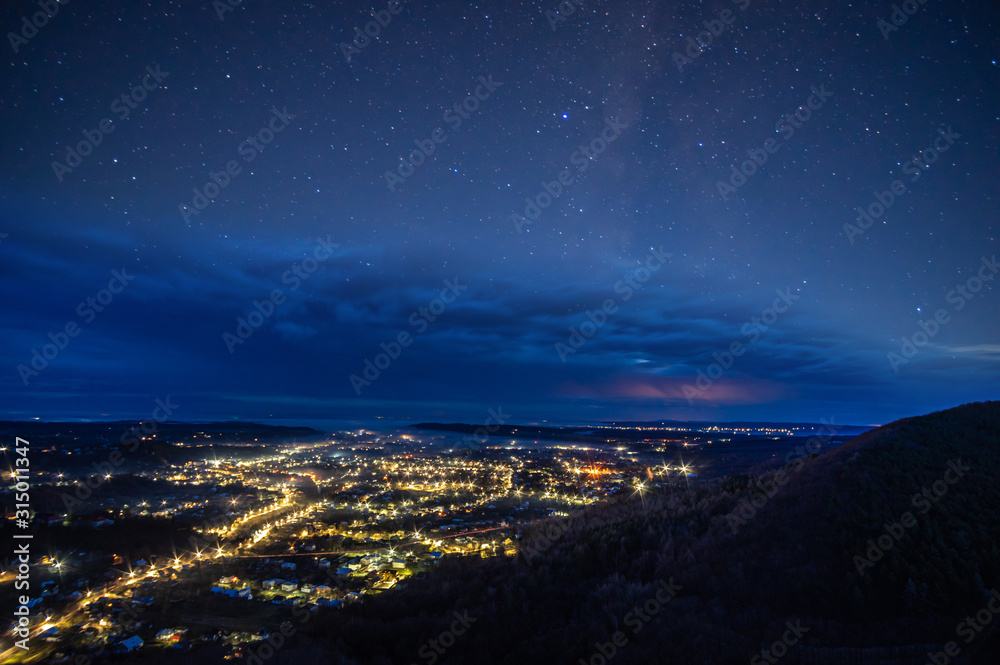 Starry sky over the night city