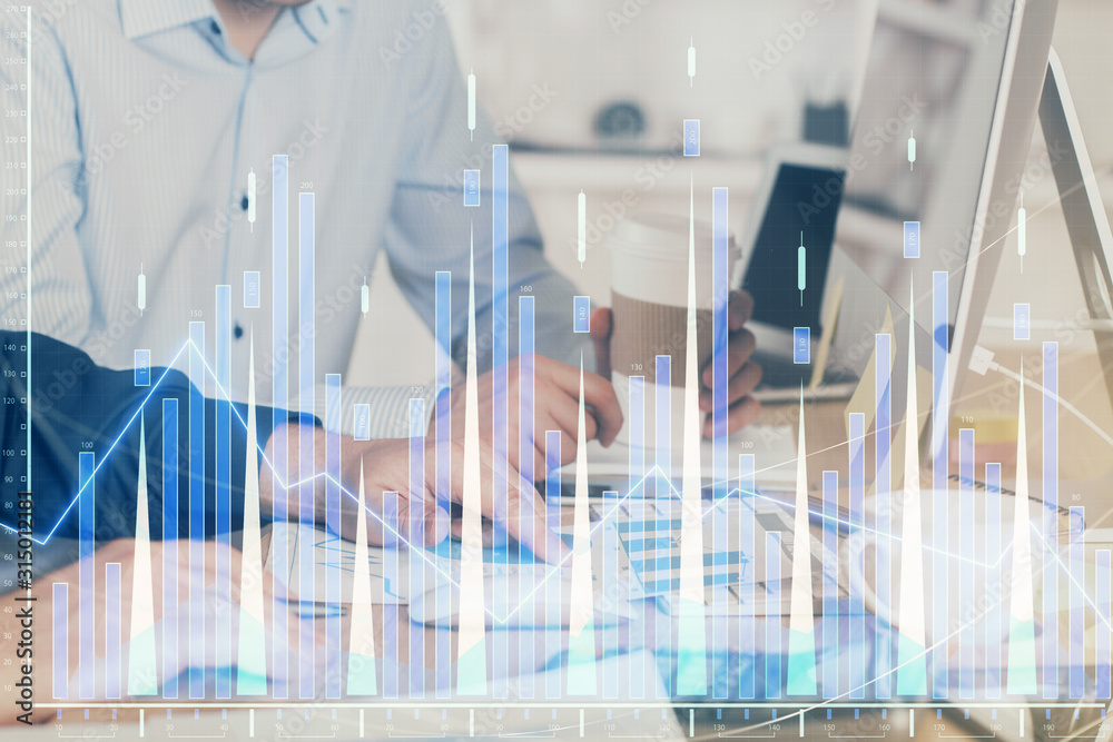 Multi exposure of chart with man typing on computer in office on background. Concept of hard work. Multi exposure of chart with man typing on computer in office on background. Concept of hard work.