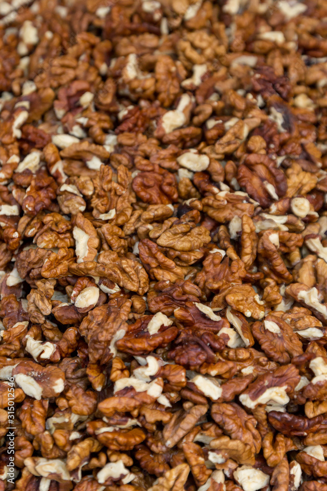 Closeup of big shelled walnuts pile. Selective focus. Closeup of big shelled walnuts pile. Selective focus.