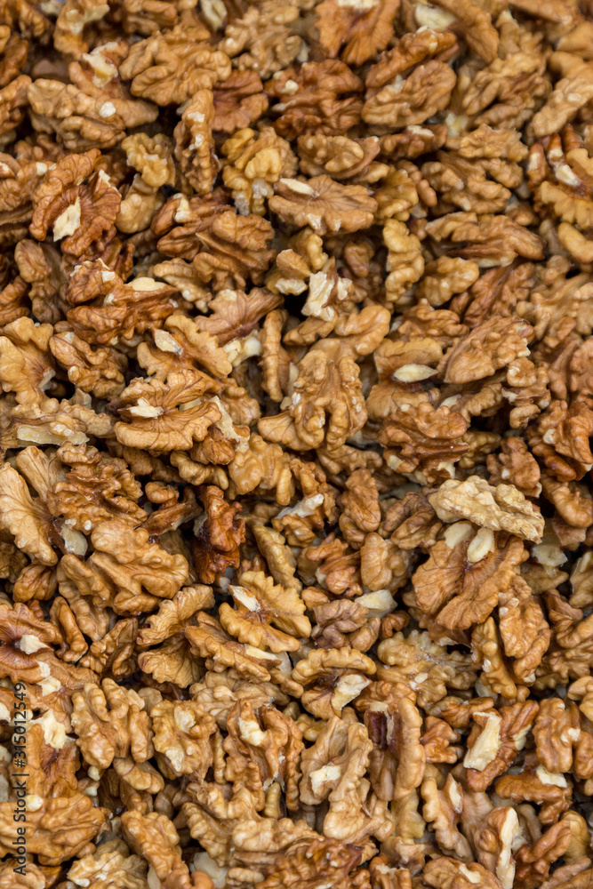 Closeup of big shelled walnuts pile. Selective focus. Closeup of big shelled walnuts pile. Selective focus.
