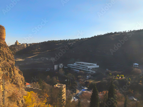 Beautiful view of the old fortress overlooking the botanical garden. Old Tbilisi, winter in the city photo