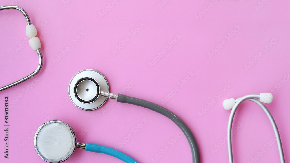 close up of stethoscope on pink background close up of stethoscope on pink background