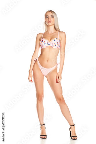 Young beautiful hot woman in bikini, isolated.