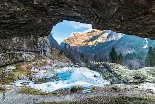 Winter. Ice games in the Fontanon of Goriuda waterfall. Friuli, Italy.