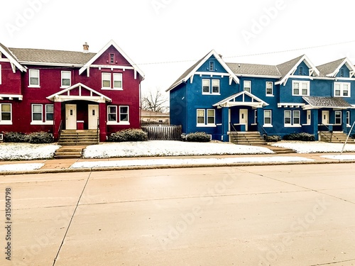 line of townhouses in winter snow