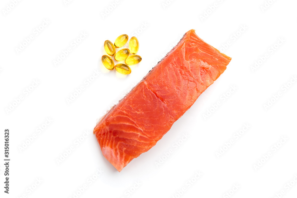 Salted trout and fish oil capsules isolated on white background.
