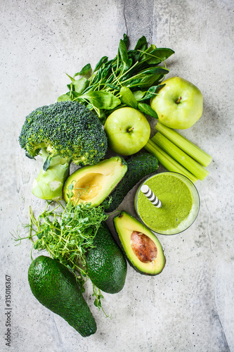 Ingredients for green detox smoothie background, top view, flat lay.