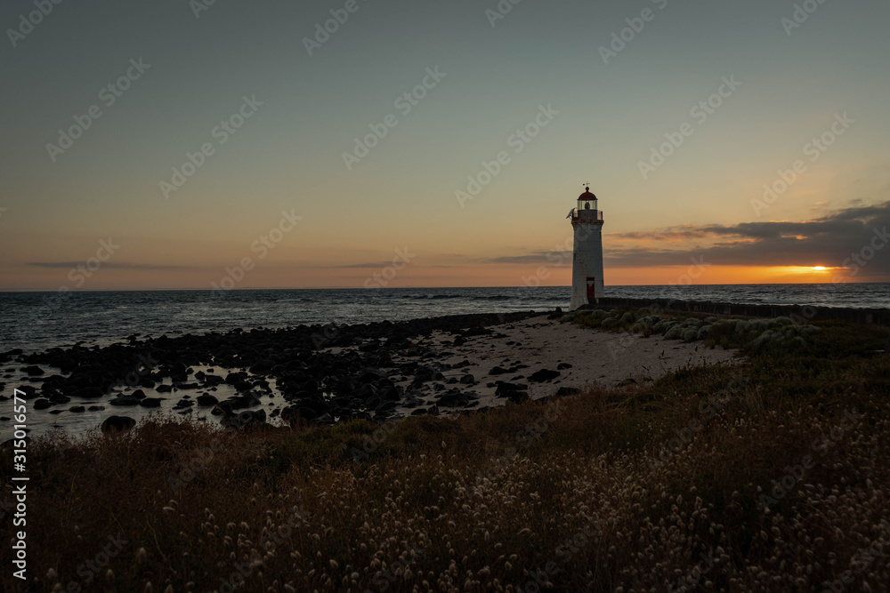 Lighthouse at a colorful sunrise