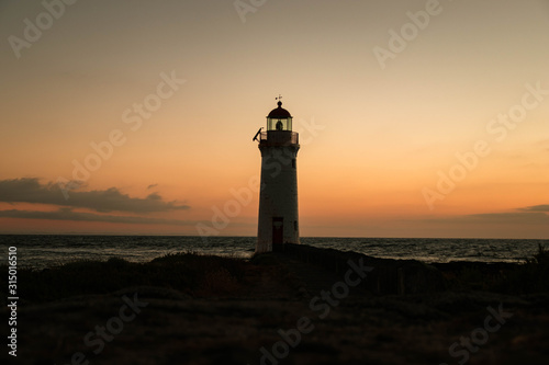 Lighthouse at a colorful sunrise
