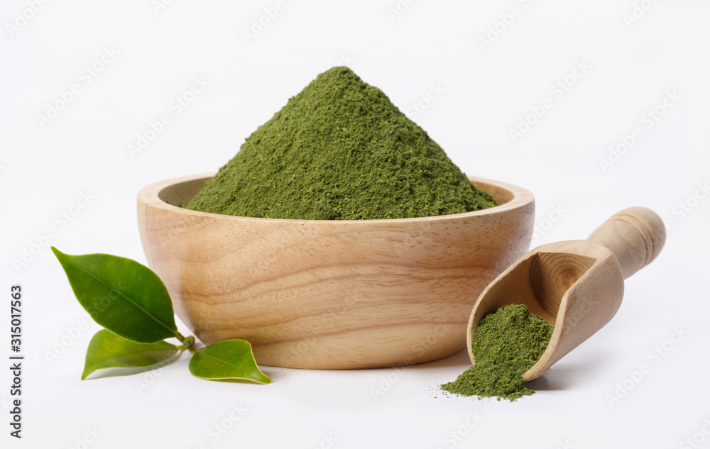 Matcha green tea powder in bowl with Organic green tea leaf isolated on white background, Organic product from the nature for healthy with traditional style - obrazy, fototapety, plakaty 