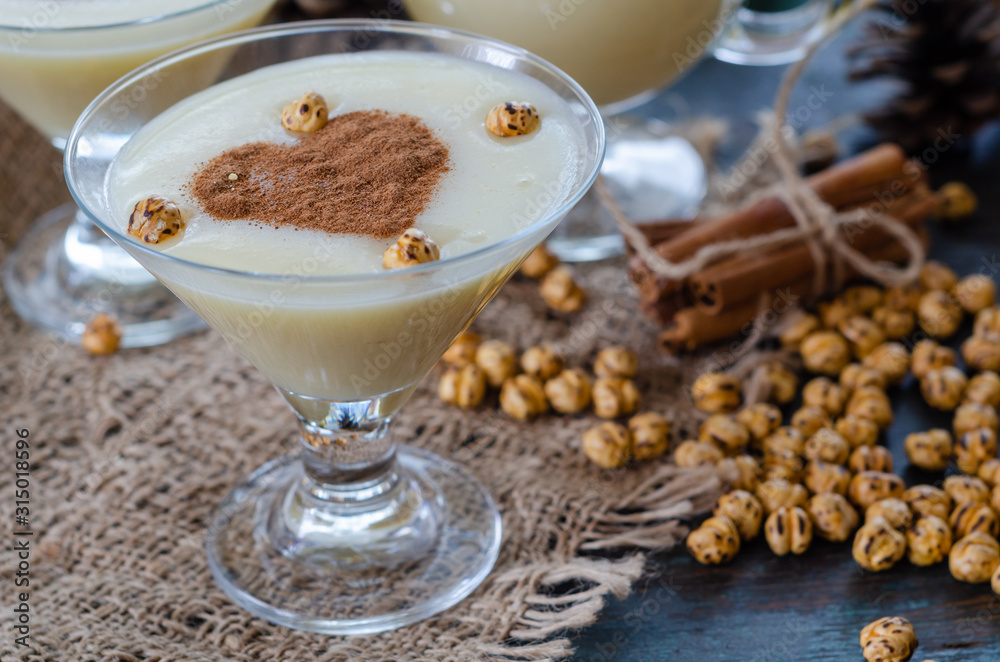 Traditional turkish drink; boza with cinnamon sticks and chickpea