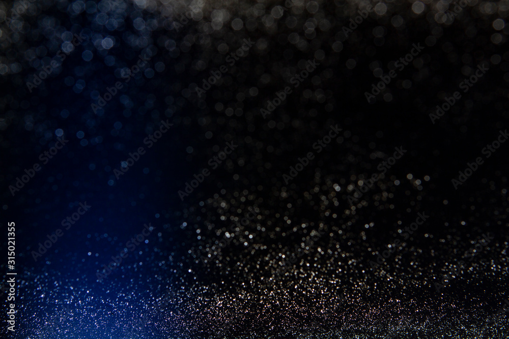 Glitter vintage lights background. Abstract blurred background.