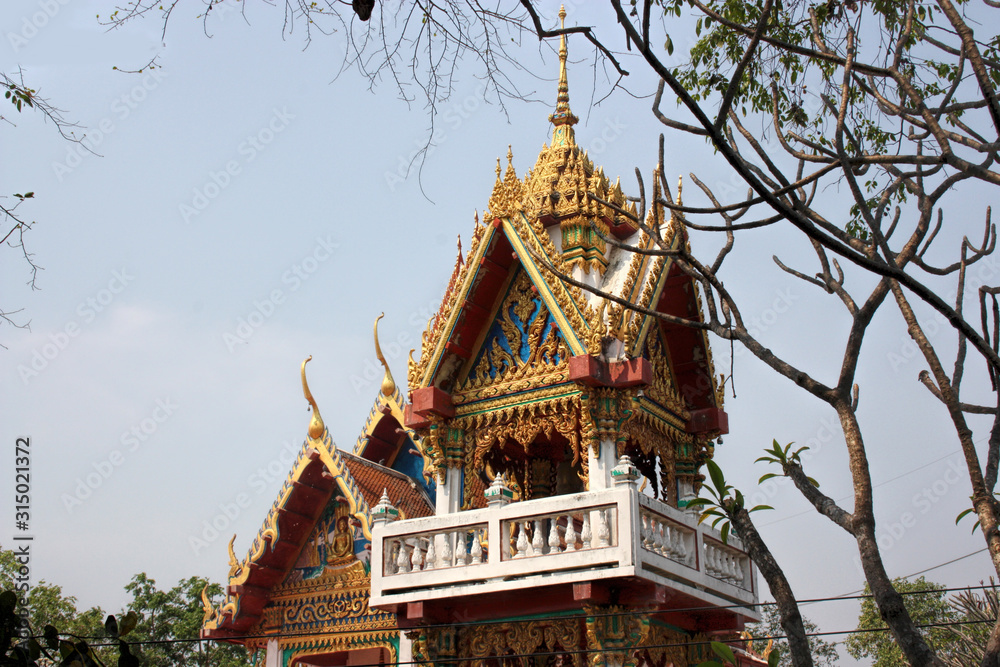 Fototapeta premium Carved multi-colored wooden building in Thailand