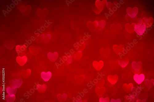 red valentines day background with hearts bokeh, love concept wallpaper