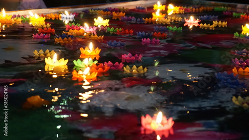 Multi colored Krathong flower made with candles