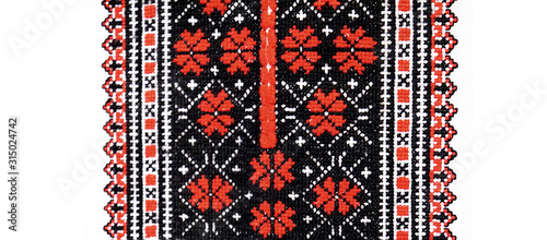 Handmade Ukrainian embroidery on fabric. Embroidered floral pattern. Beautiful flowers.