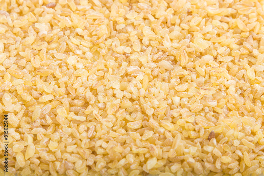 Texture of raw bulgur. Side view, close up, macro. Natural background. Texture of raw bulgur. Side view, close up, macro. Natural background.