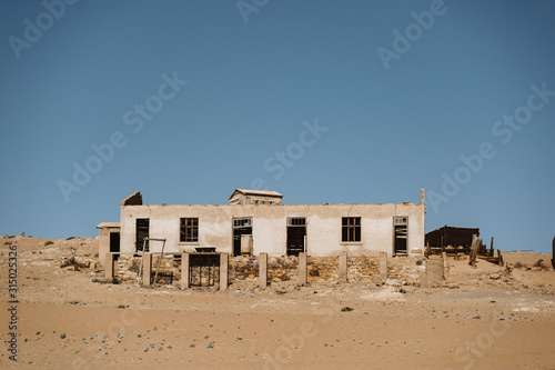 home ruins in the African desert sunk in sand