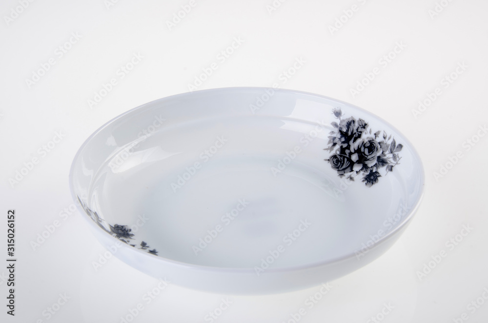plate or hand painted plate on a background new. plate or hand painted plate on a background new.