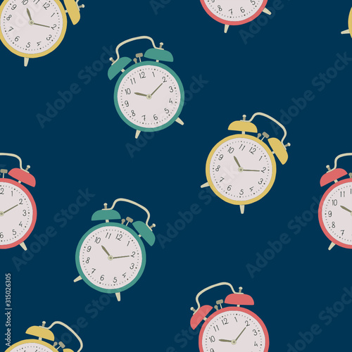 Alarm clock pattern. Vector alarm clock on dark blue background. Colorful seamless pattern.