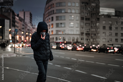 Child with Air Pollution Mask, Traffic in the Background