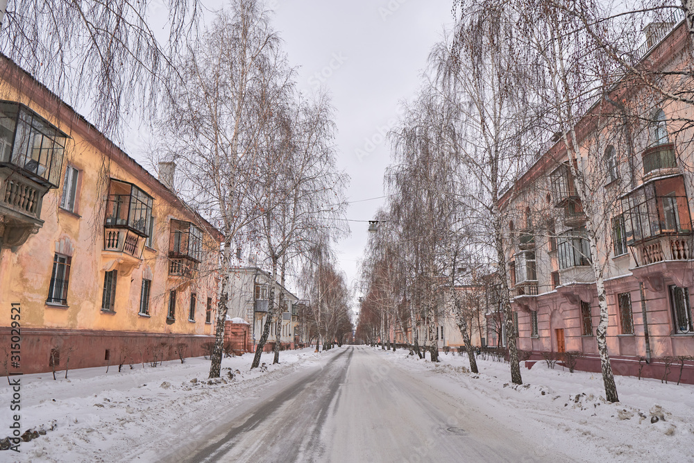 Architecture of Magnitogorsk city; beautiful streets, apartment houses of provincial town in Russia with small architectural forms on building facade; design elements, decorations; winter cityscape Architecture of Magnitogorsk city; beautiful streets, apartment houses of provincial town in Russia with small architectural forms on building facade; design elements, decorations; winter cityscape