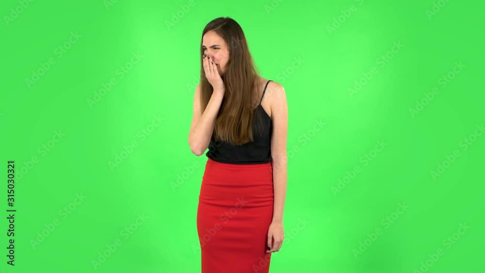 Girl got a cold, sore throat and head, cough on green screen at studio. Green screen Girl got a cold, sore throat and head, cough on green screen at studio. Green screen