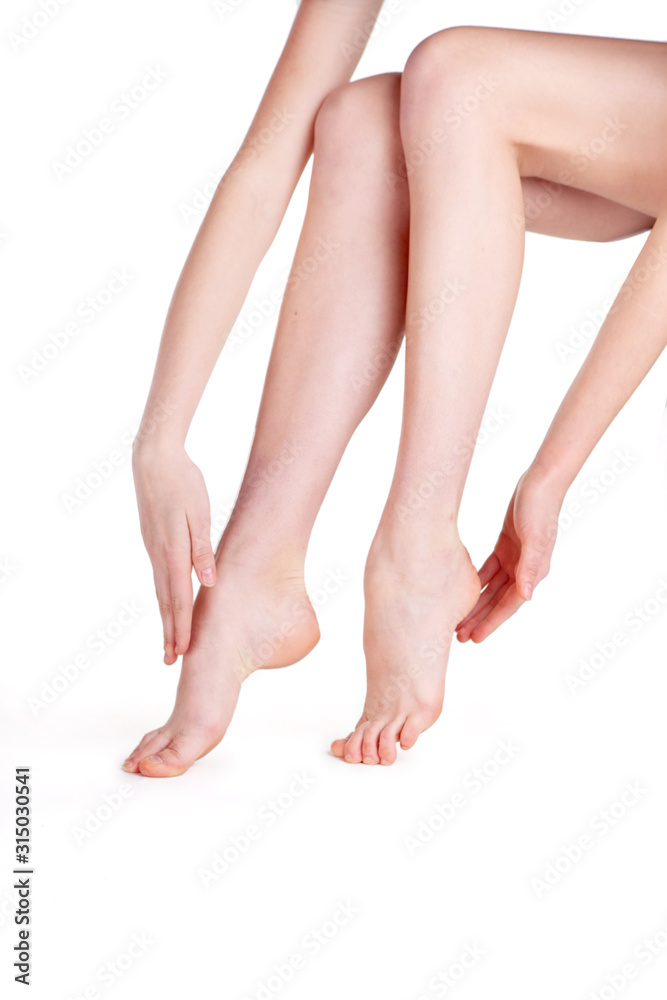 female legs on a white background in studio female legs on a white background in studio