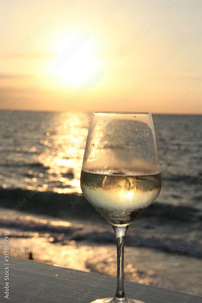 glass of wine at sunset