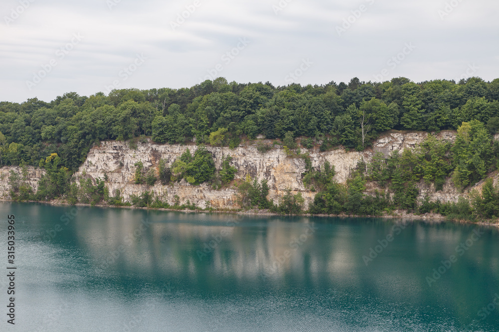 Zakrzowek Lagoon, former quarry with clean azure water. Cracow, Poland.