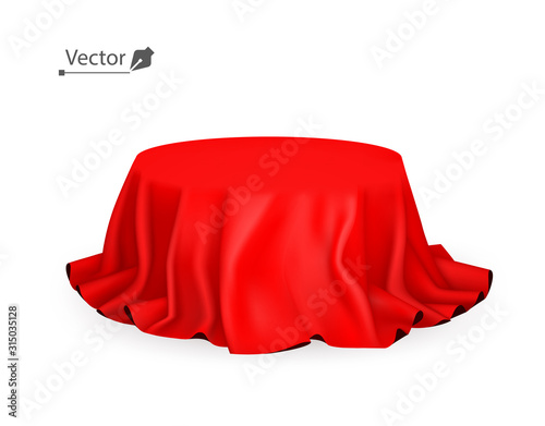 Pedestal or place for a product covered with red silk. Reveal the hidden object. Empty podium, stand with tablecloth to show magic tricks.