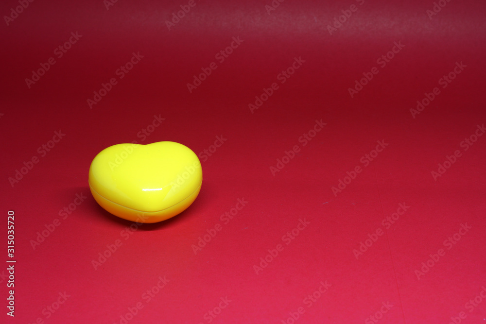 Single or Lonely ( 1 ) Yellow Heart Object on red Background - Valentine Day - Finding couple lover Concept with Copy space Single or Lonely ( 1 ) Yellow Heart Object on red Background - Valentine Day - Finding couple lover Concept with Copy space