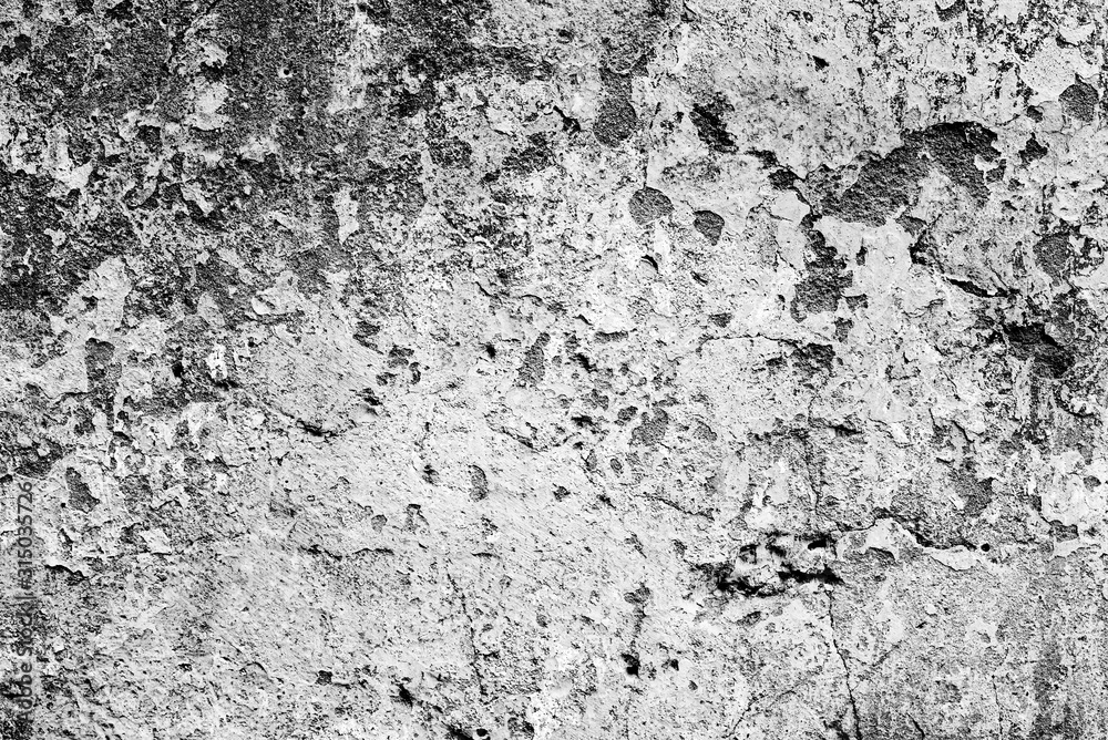Fototapeta premium Texture of a concrete wall with cracks and scratches which can be used as a background